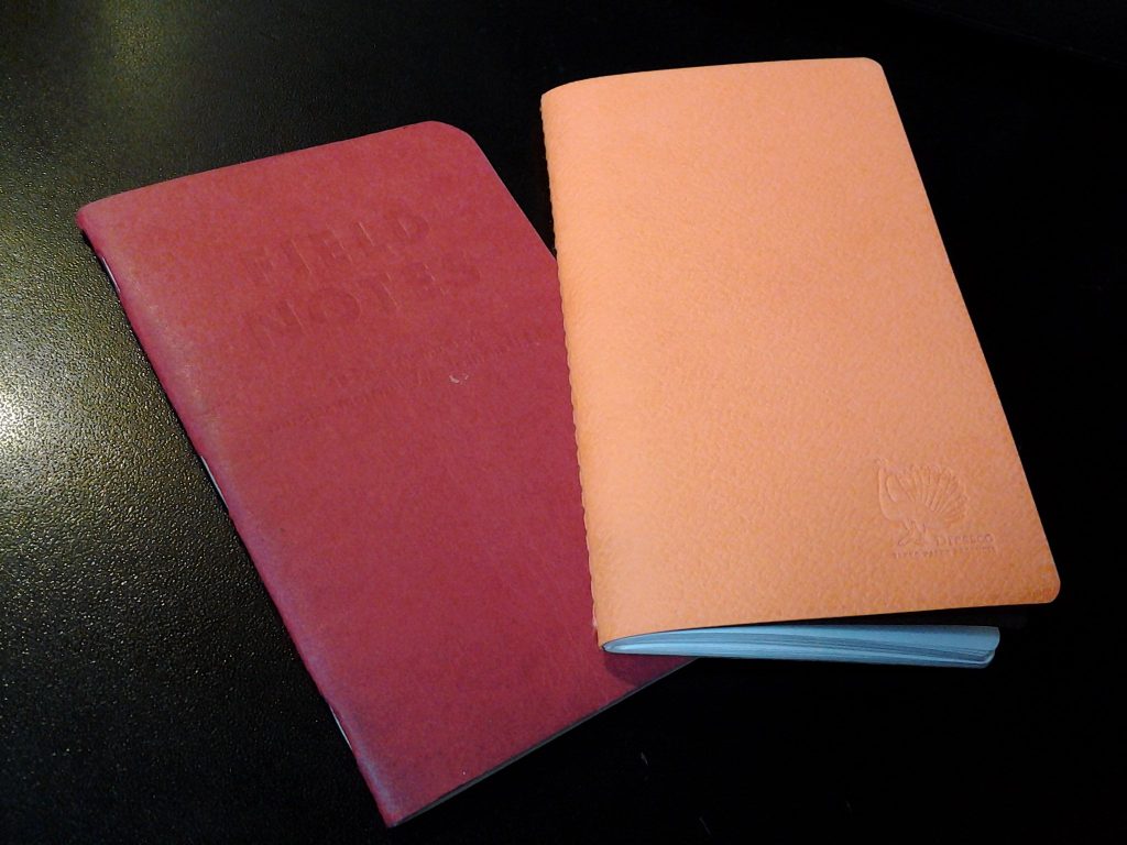 The Stitchnote (left) next to a Field Notes Red Blooded.